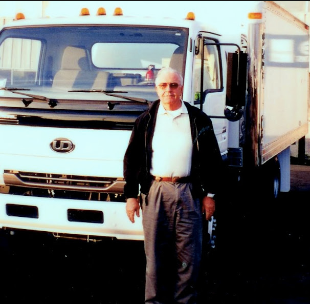 Bob Winchell next to work truck in the 1900s